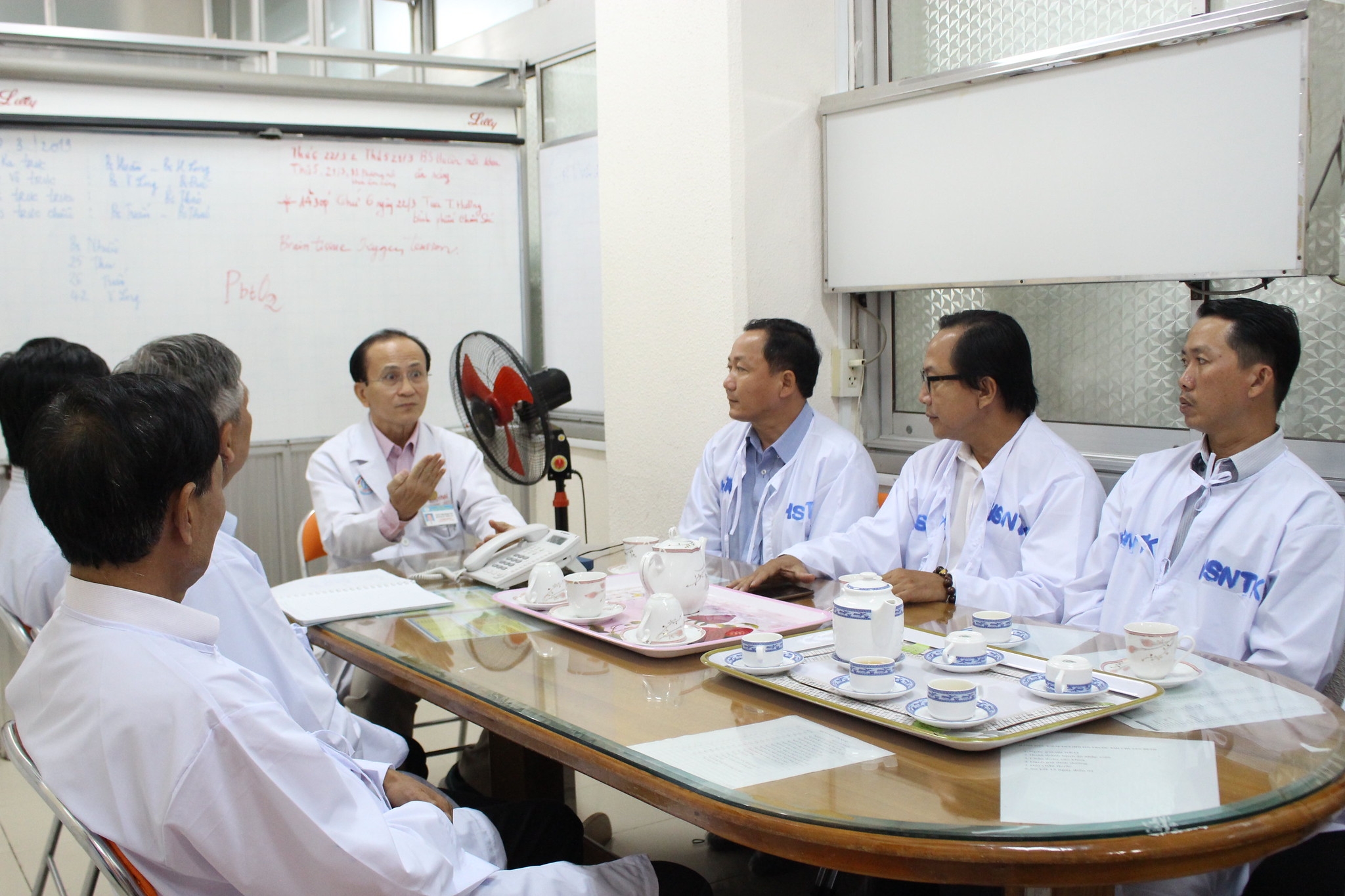 Doctors and participants discussing road crash consequences.