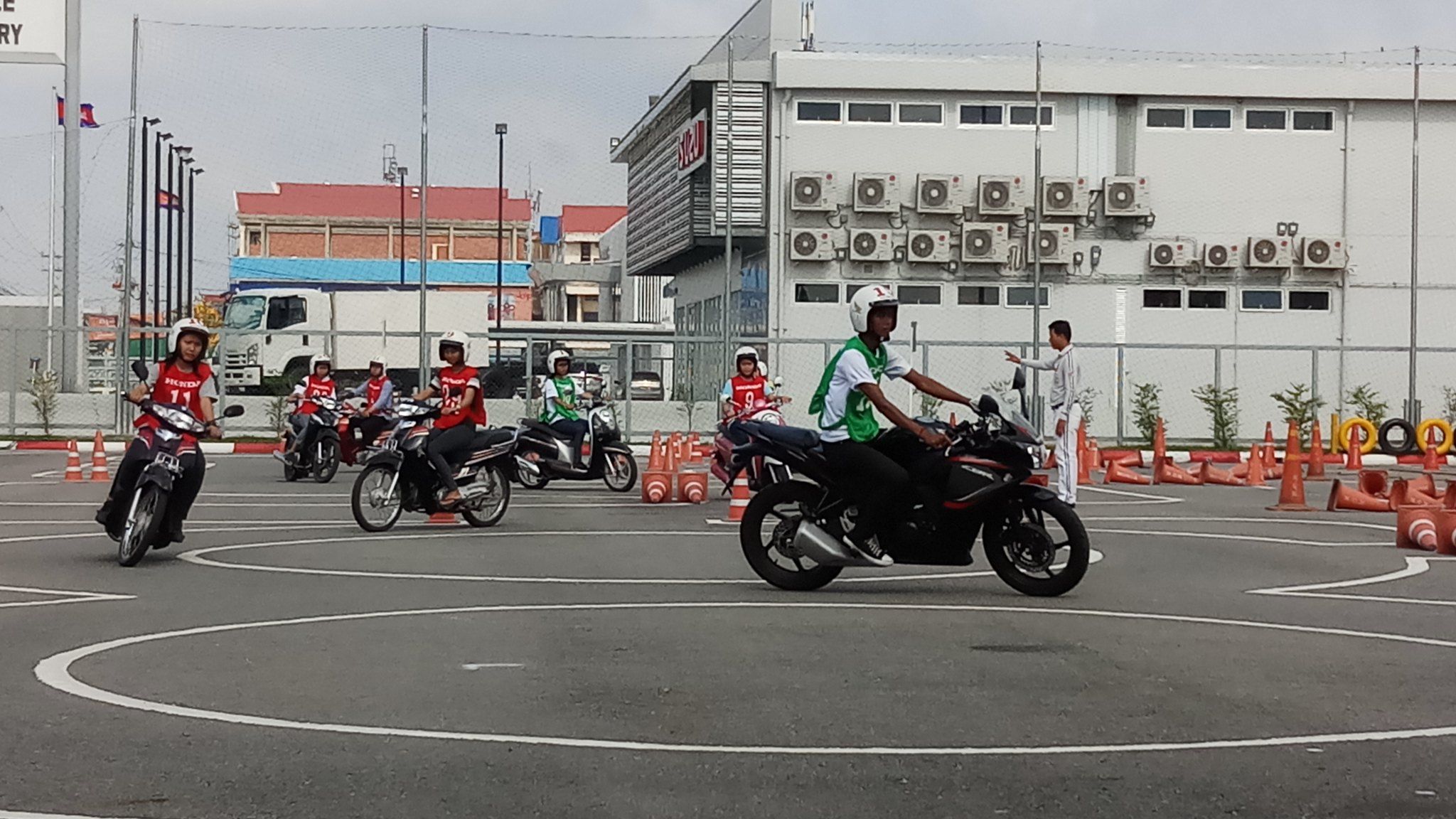 Youth road safety ambassadors practice their driving skills on the Honda course.