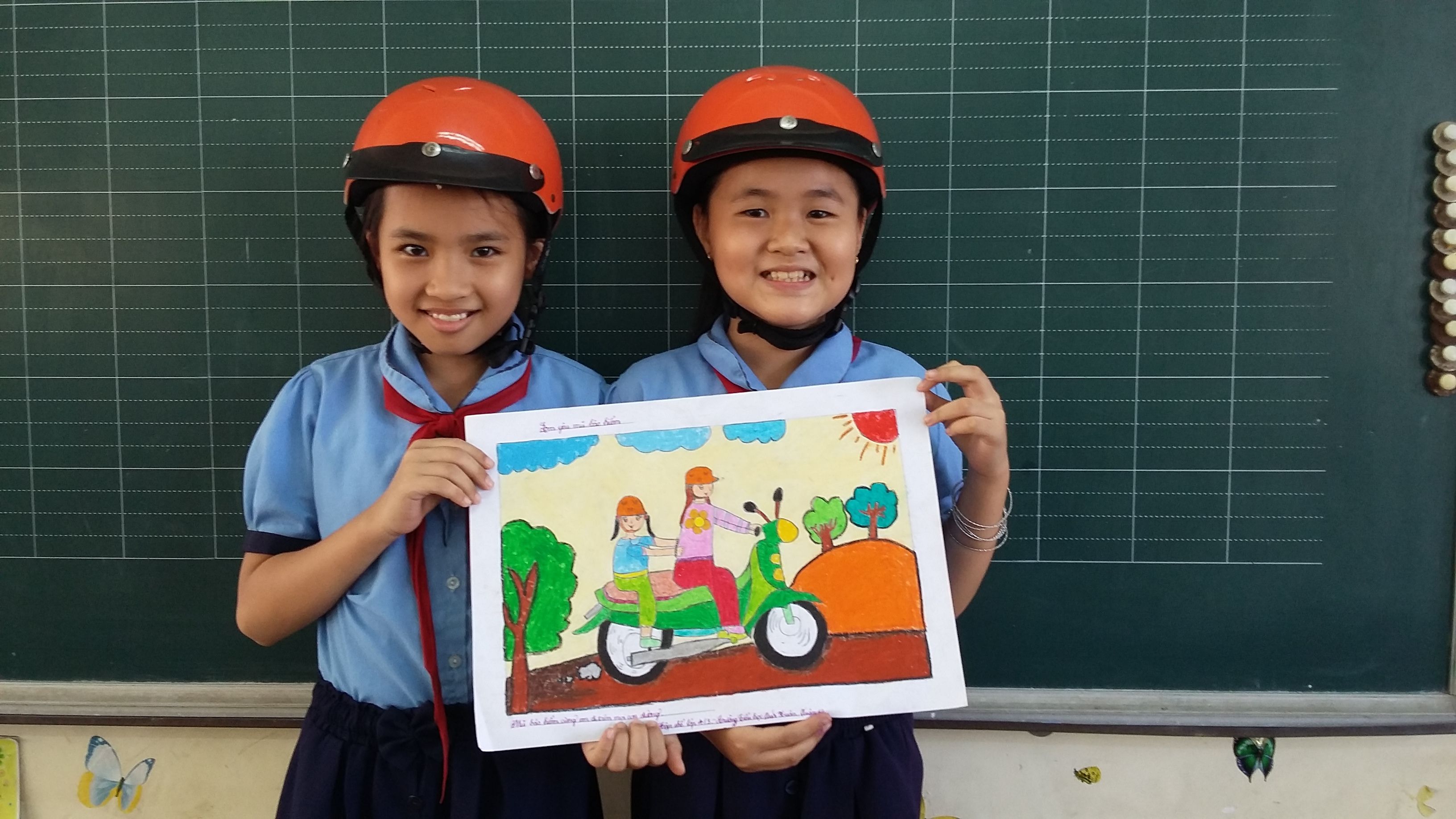 Primary students with their safe travel drawing