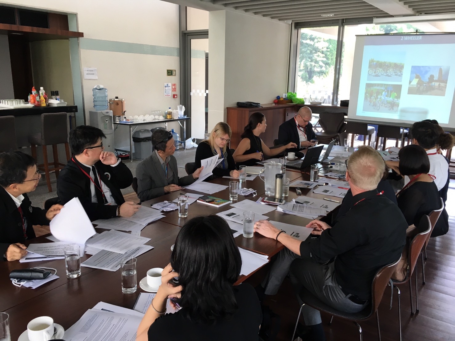 Meeting attendees discuss 2- and 3-wheel vehicle safety on Thailand’s roads.