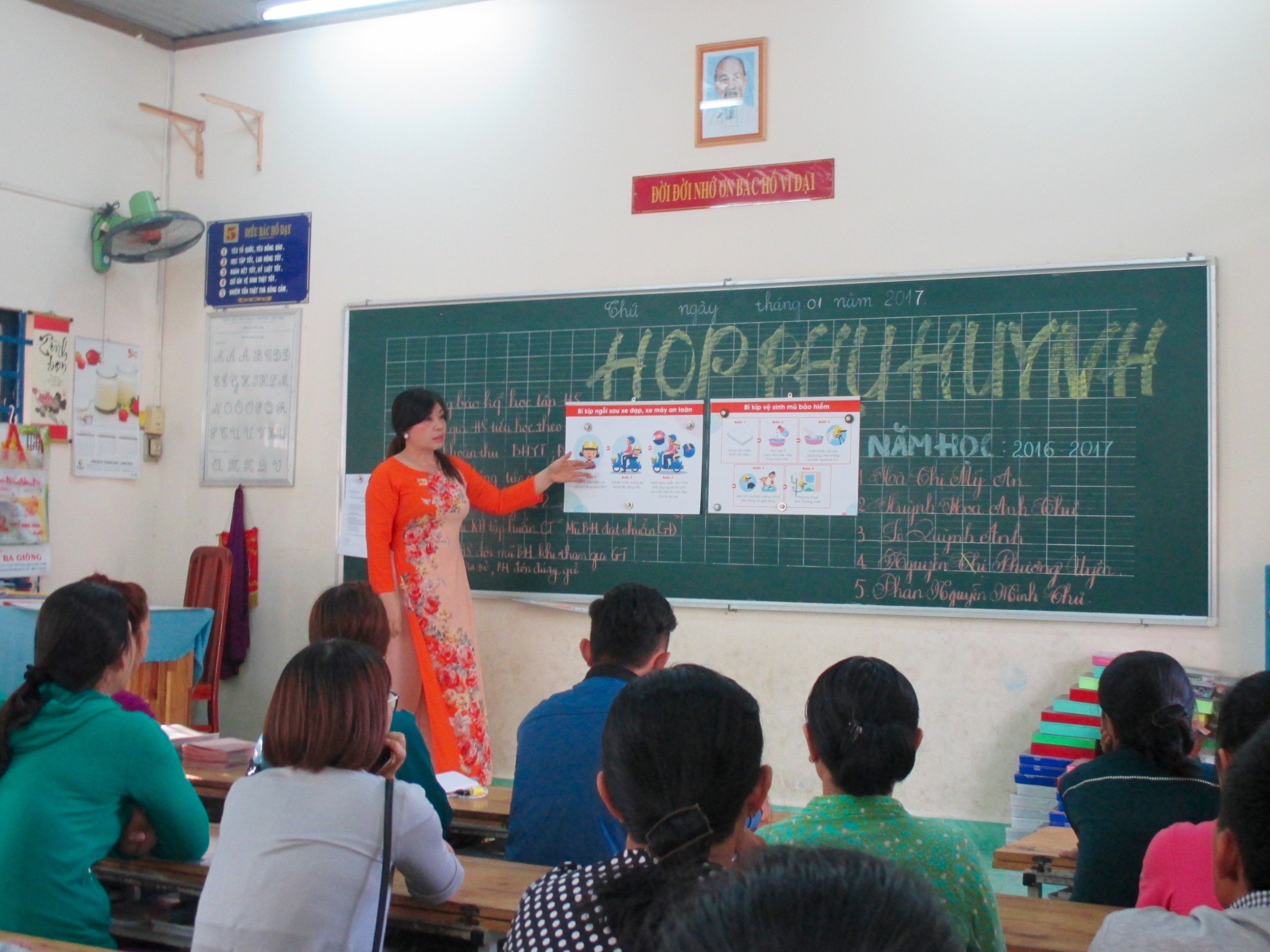 After being trained on the Helmets for Families road safety curriculum, a teacher shares her knowledge with other school staff.