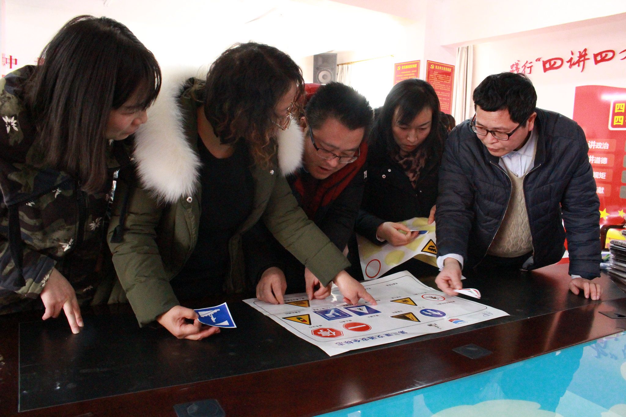 Teachers practice their traffic sign knowledge during a breakout session of the training workshop.