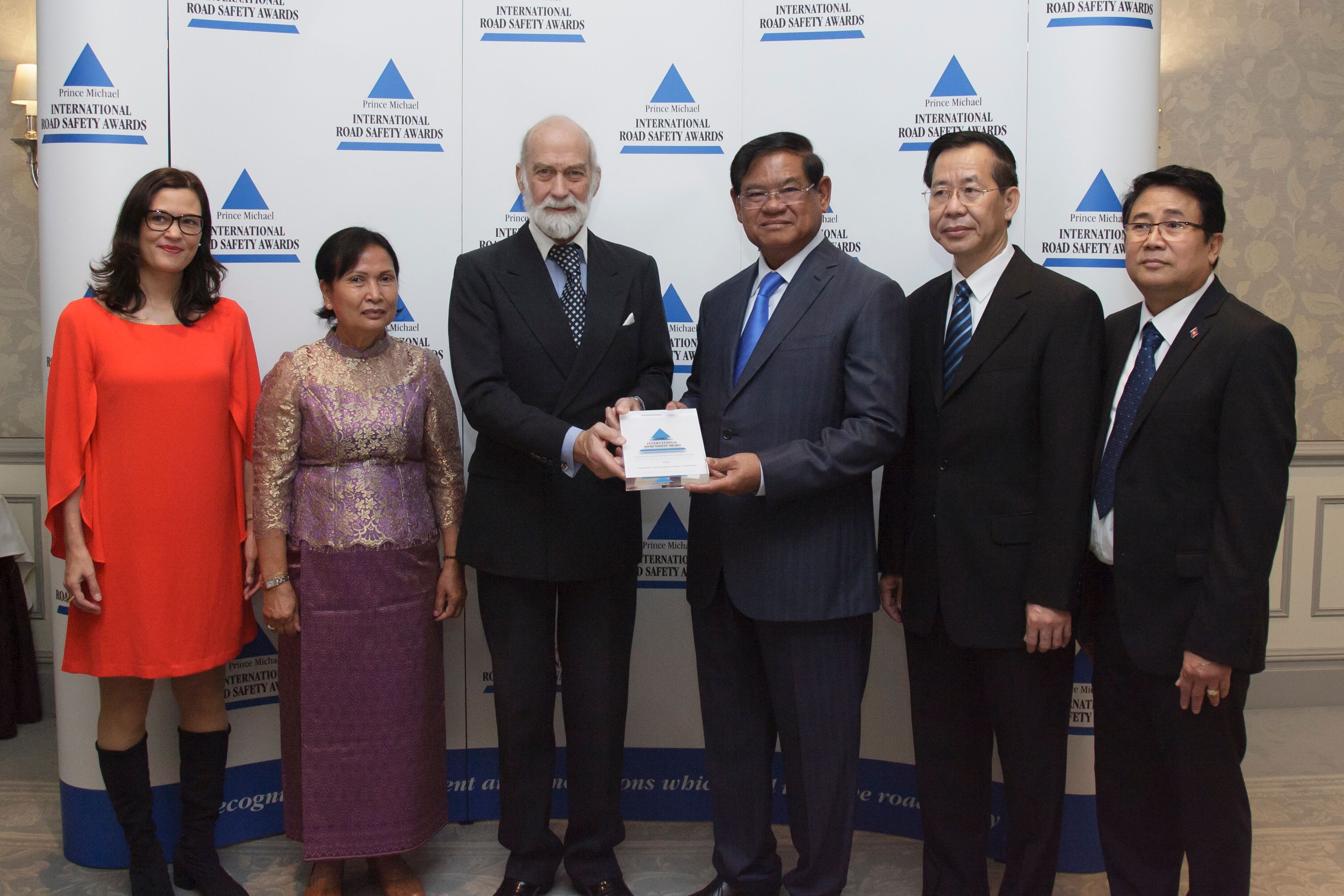 H.R.H. Prince Michael of Kent (center) presents the award to members of Cambodia’s National Road Safety Committee, who are joined by AIP Foundation CEO, Mirjam Sidik (left).