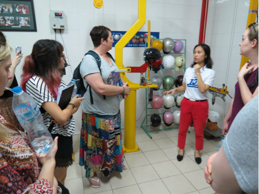 Nguyen Anh Cam, HR Manager of Protec, takes University of Adelaide students on a tour of the Protec factory in Hanoi.
