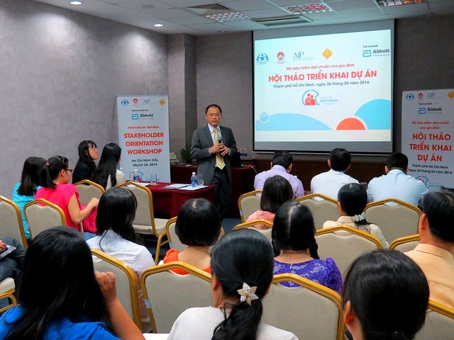 Abbott Laboratories, government partners, traffic police, and school principals collaborate to promote standard helmets for students and their parents.