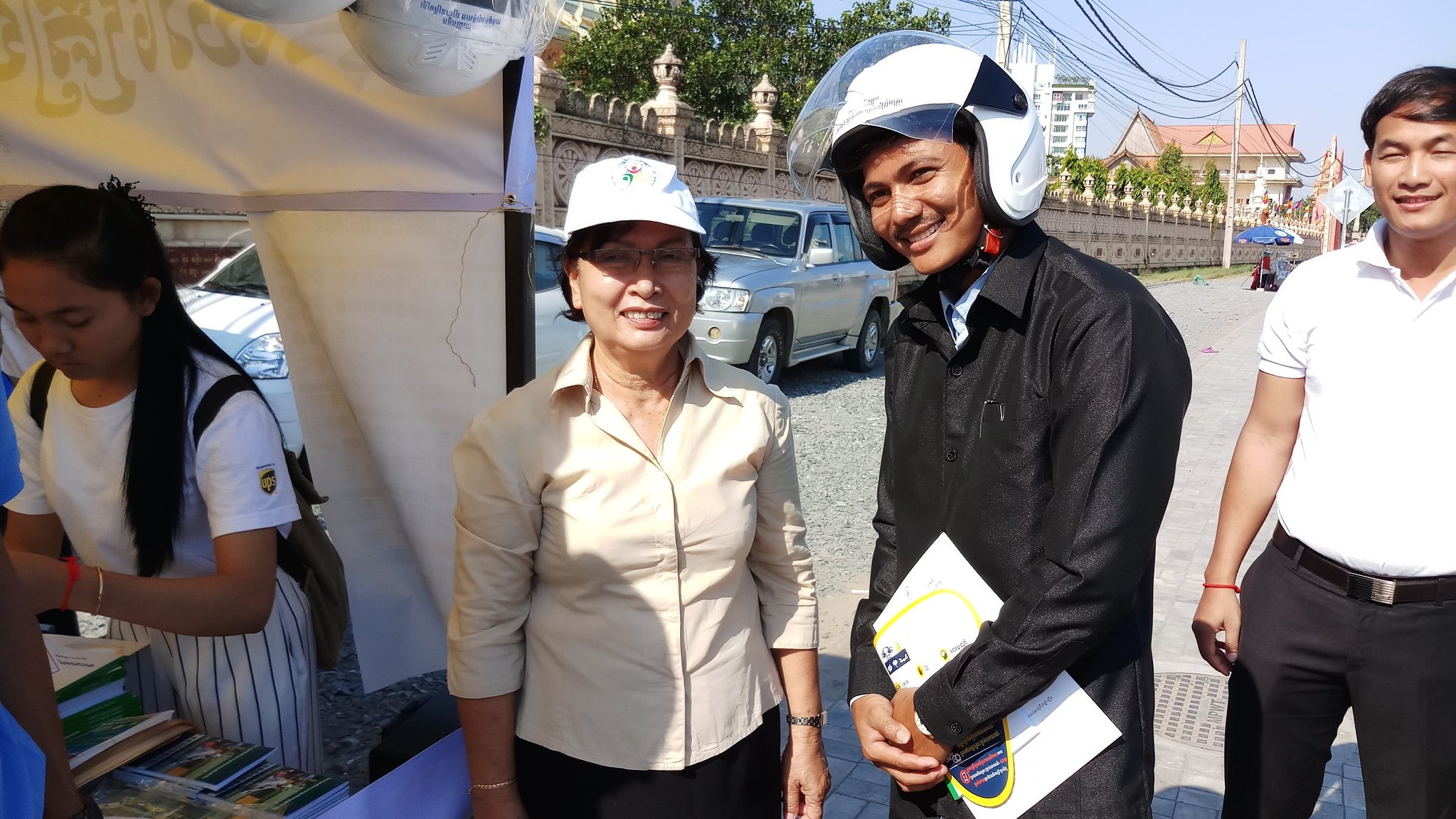 General Secretariat of the National Road Safety Committee H.E. Min Meanvy supports the student ambassadors in spreading distracted driving messaging.