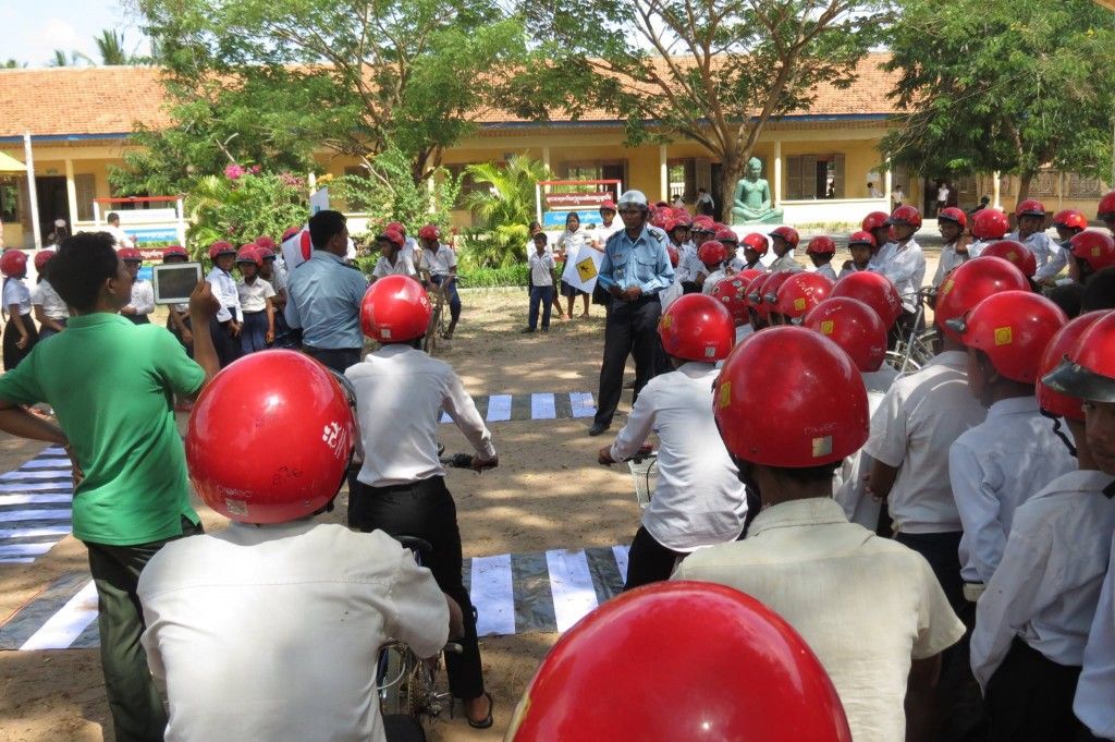 Police officers instruct students on proper pedestrian and bicycle safety skills