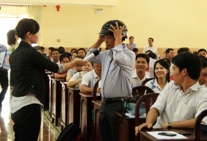 AIP Foundation staff discuss proper helmet use with participants