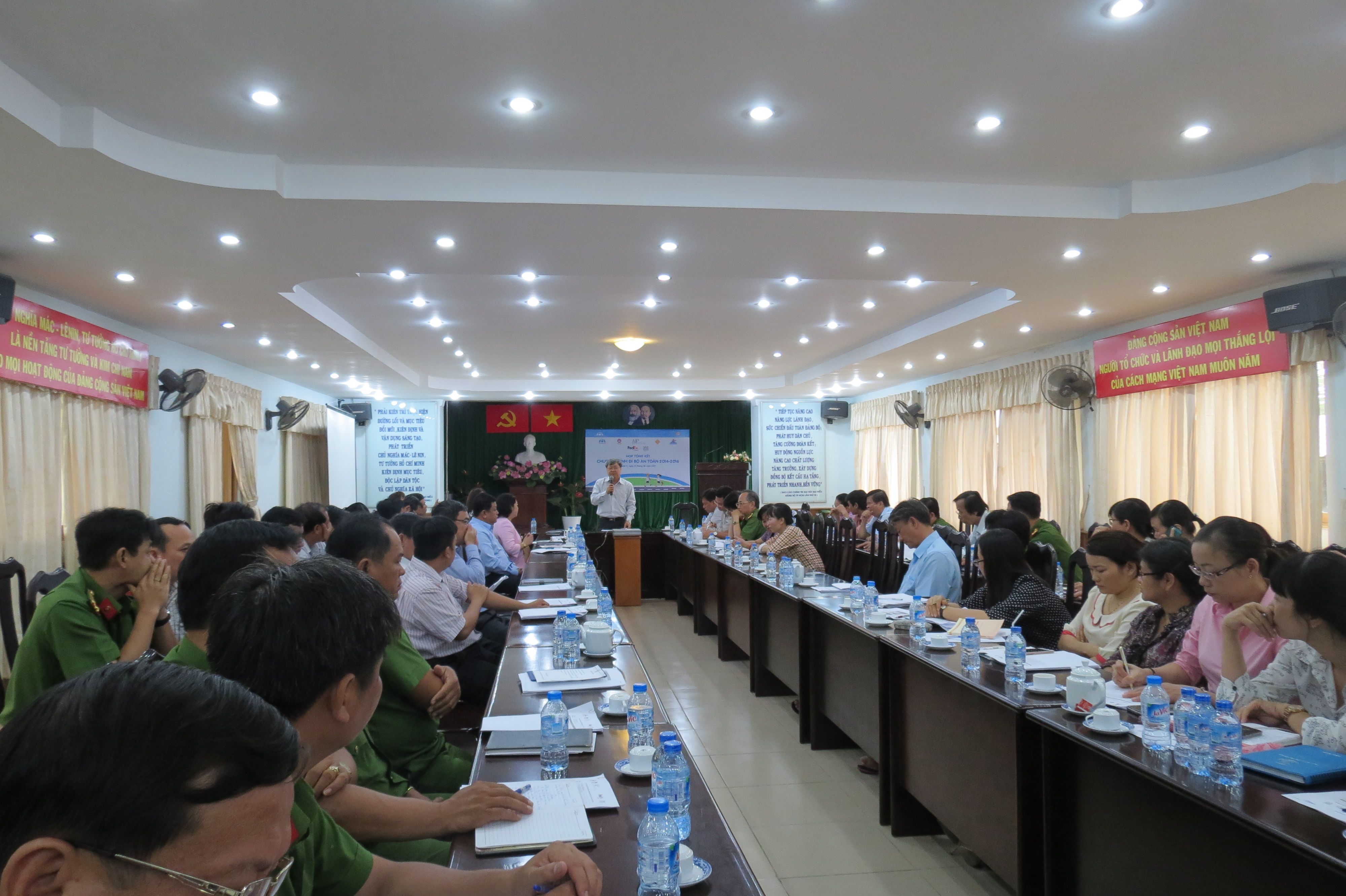 Government officials join AIP Foundation staff, operating as Safe Kids Vietnam, to review the results from the past two years of Walk This Way in District 9 of Ho Chi Minh City.