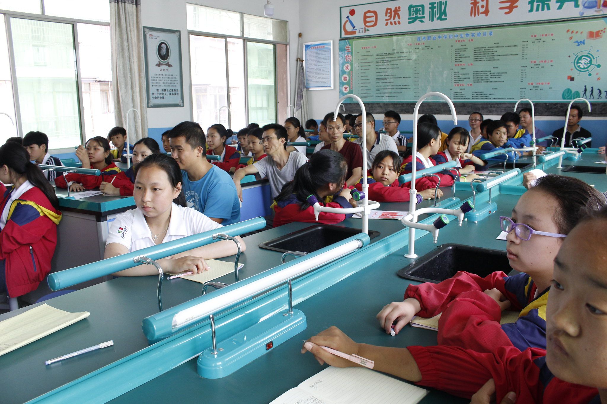 A teacher presents a self-designed road safety curriculum to students during a classroom simulation.