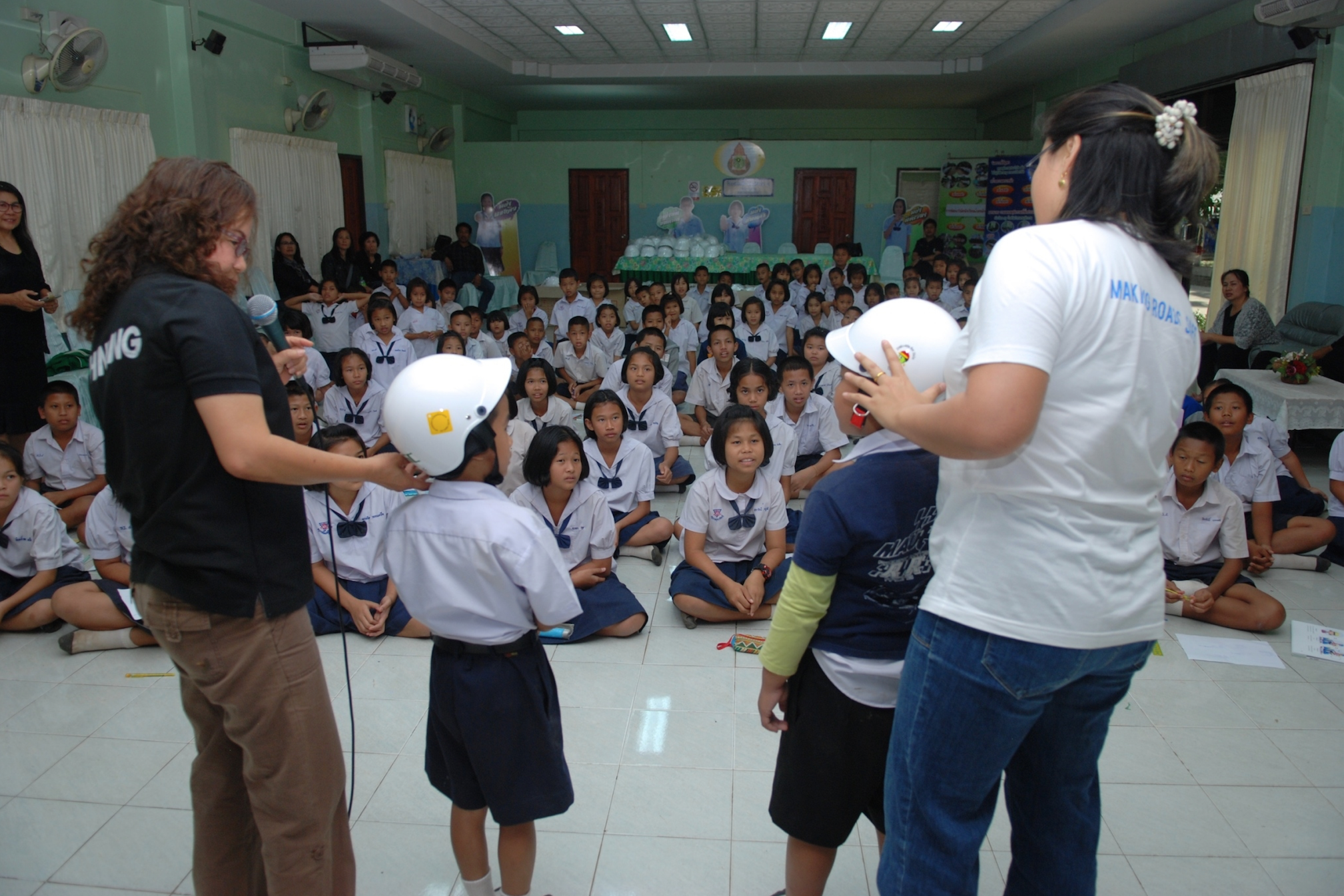 Teachers train their students in helmet safety prior to the official launch of the Helmets for Kids program in Uttaradit Province.