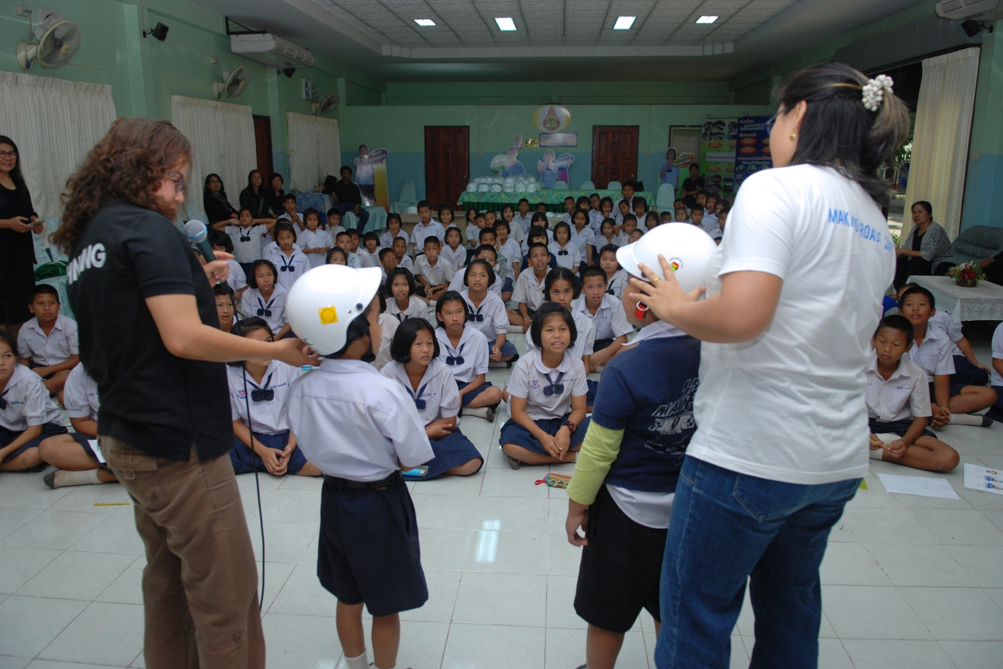 Teachers train their students in helmet safety prior to the official launch of the Helmets for Kids program in Uttaradit Province.