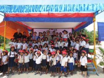 Top Phnom Penh businesses ride together to fund helmets for first graders