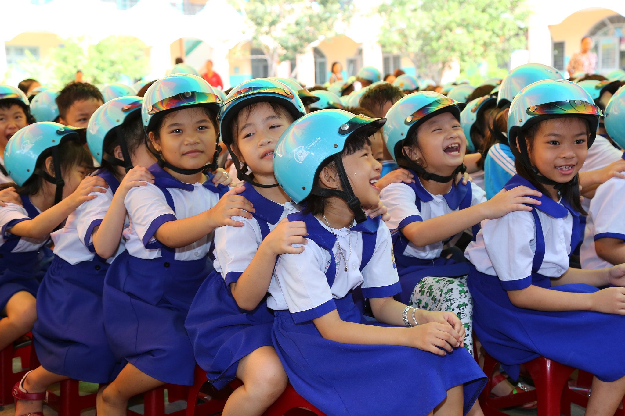 Students from Tan PhuTrung Primary School in the Cu Chi District of Ho Chi Minh City participate in the Helmets for Families road safety festival.