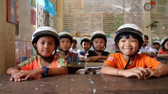 Children participating in the Helmets for Families program in Kampong Cham City