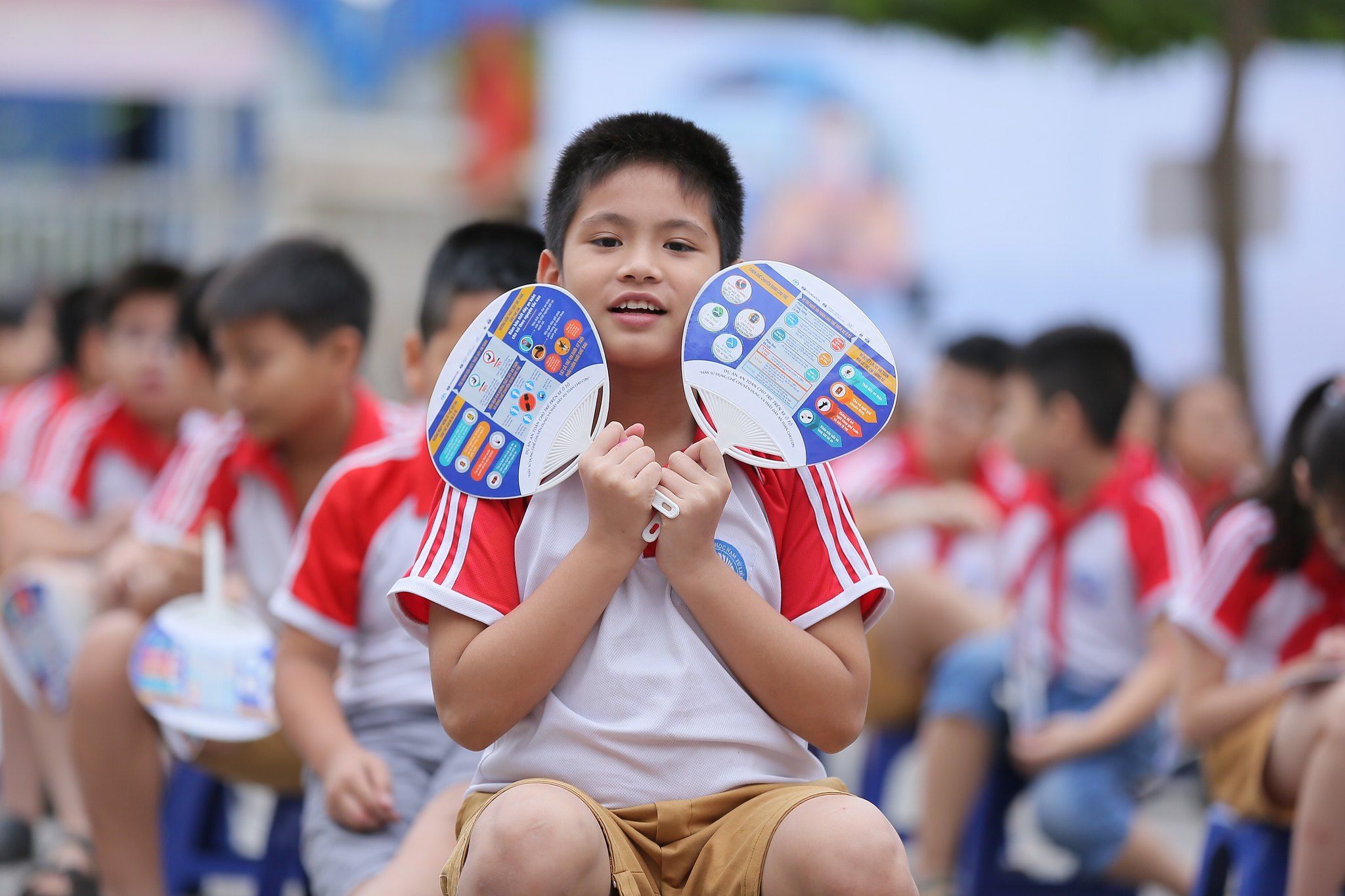 A student showcases his educational materials from the event