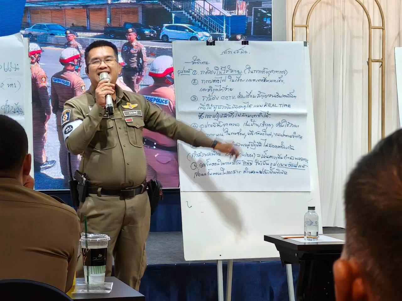 Chonburi Police representative presenting road safety model