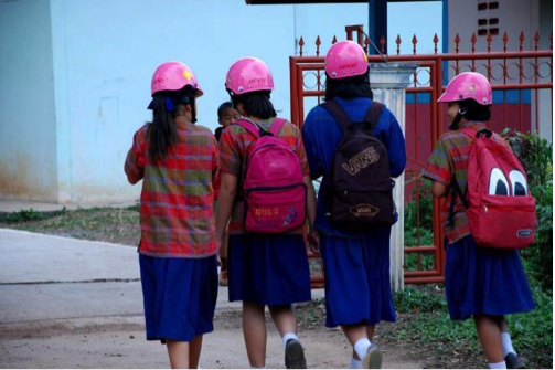 Students leave one of the project schools in Udon Thani wearing their helmets. This image would have been unthinkable just a few years ago, when there was no culture of helmet use in the area.