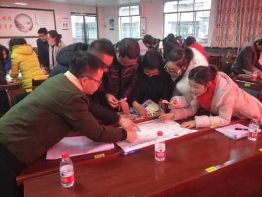 A group of teachers collaborating at a training workshop.