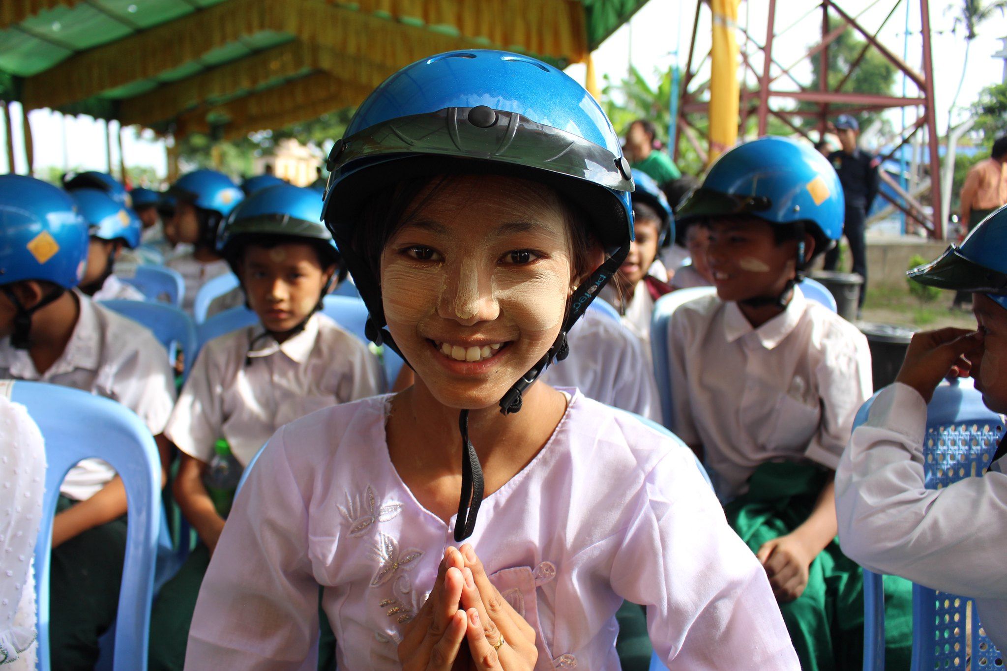 Student at School 19 in Aung Myae Thar San Township wearing her new Safety Delivered helmet