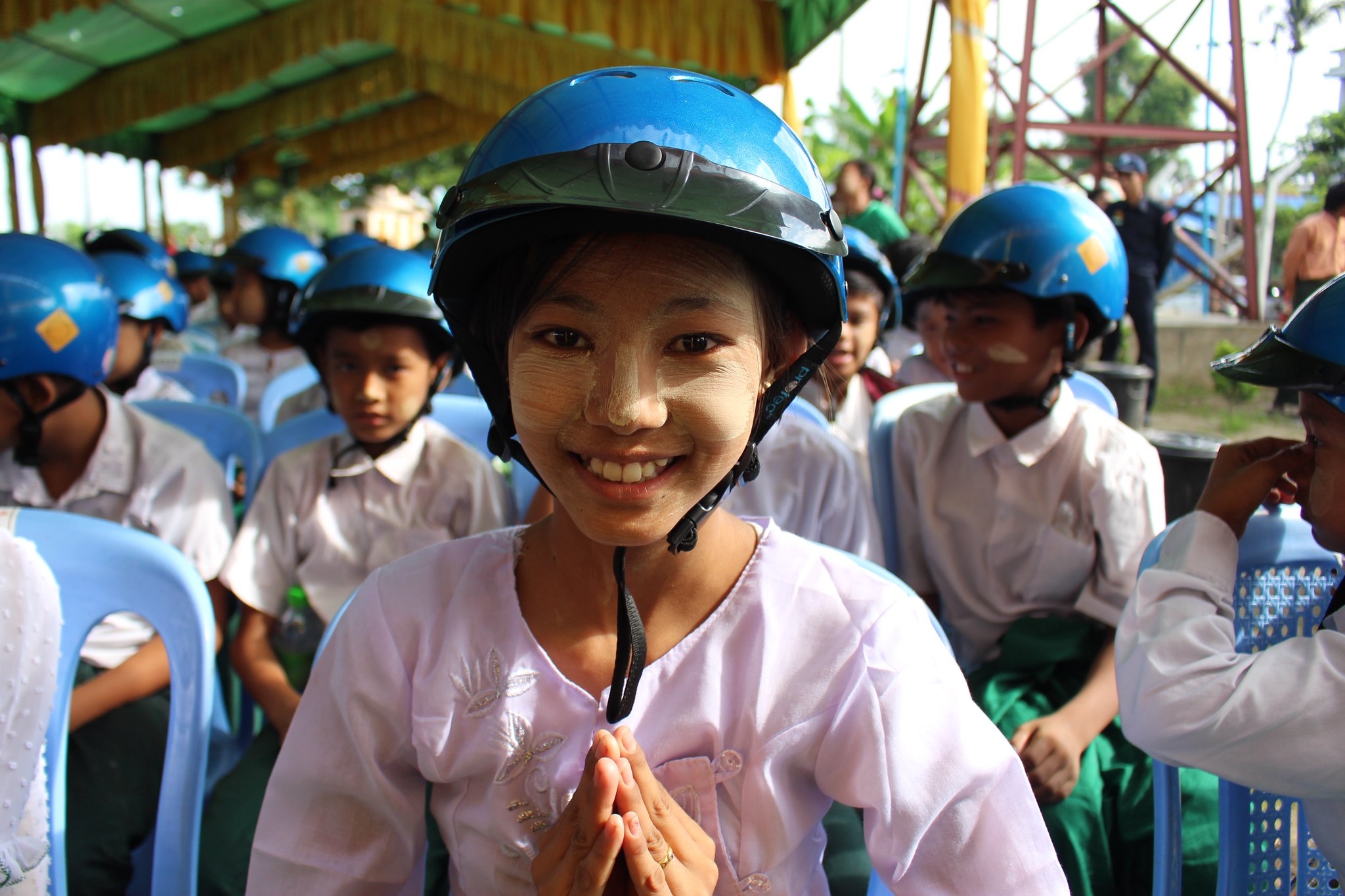 Student at School 19 in Aung Myae Thar San Township wearing her new Safety Delivered helmet