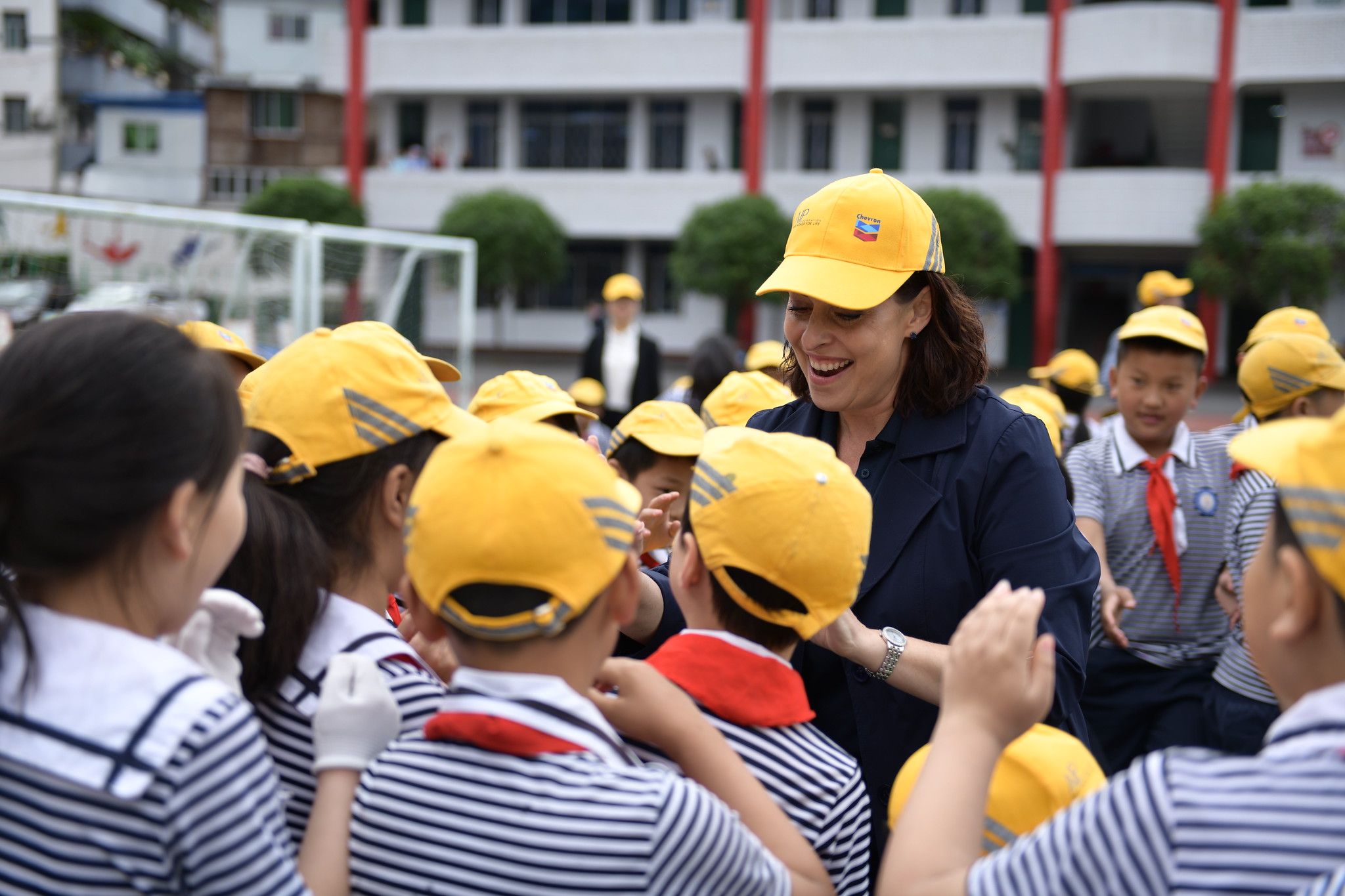 Dee Bourbon of Chevron with students of Nanba No. 1 Primary School at the celebration event.