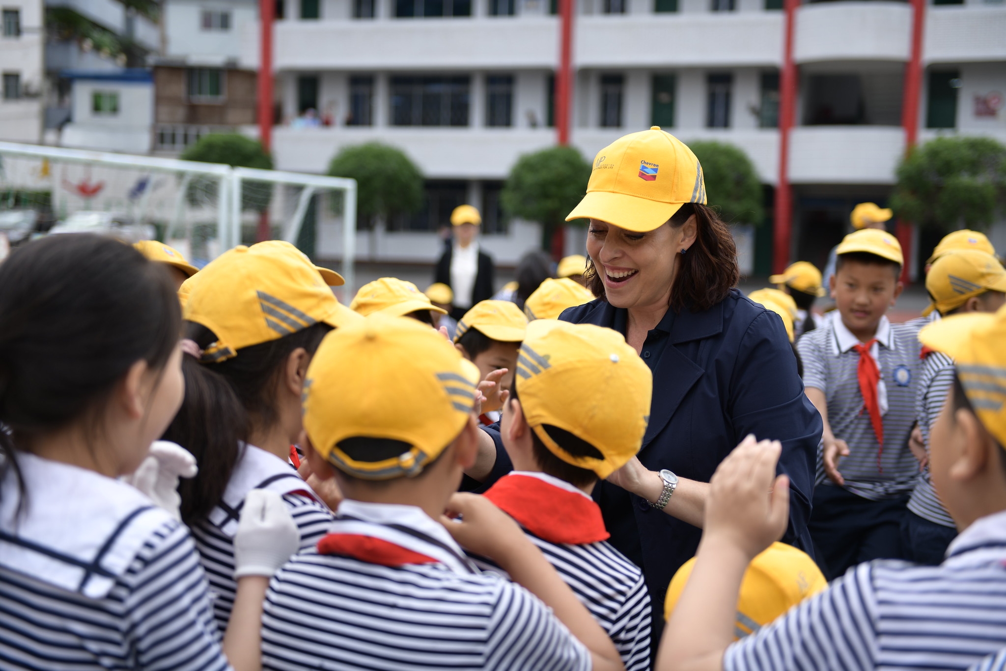 Dee Bourbon of Chevron with students of Nanba No. 1 Primary School at the celebration event.