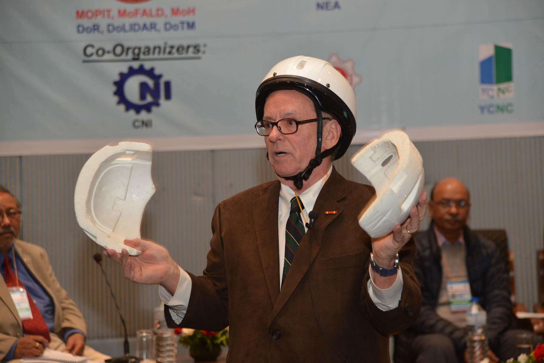 AIP Foundation President Greig Craft demonstrates components of a quality helmet during his presentation at the National Conference on Road Safety in Kathmandu, Nepal.