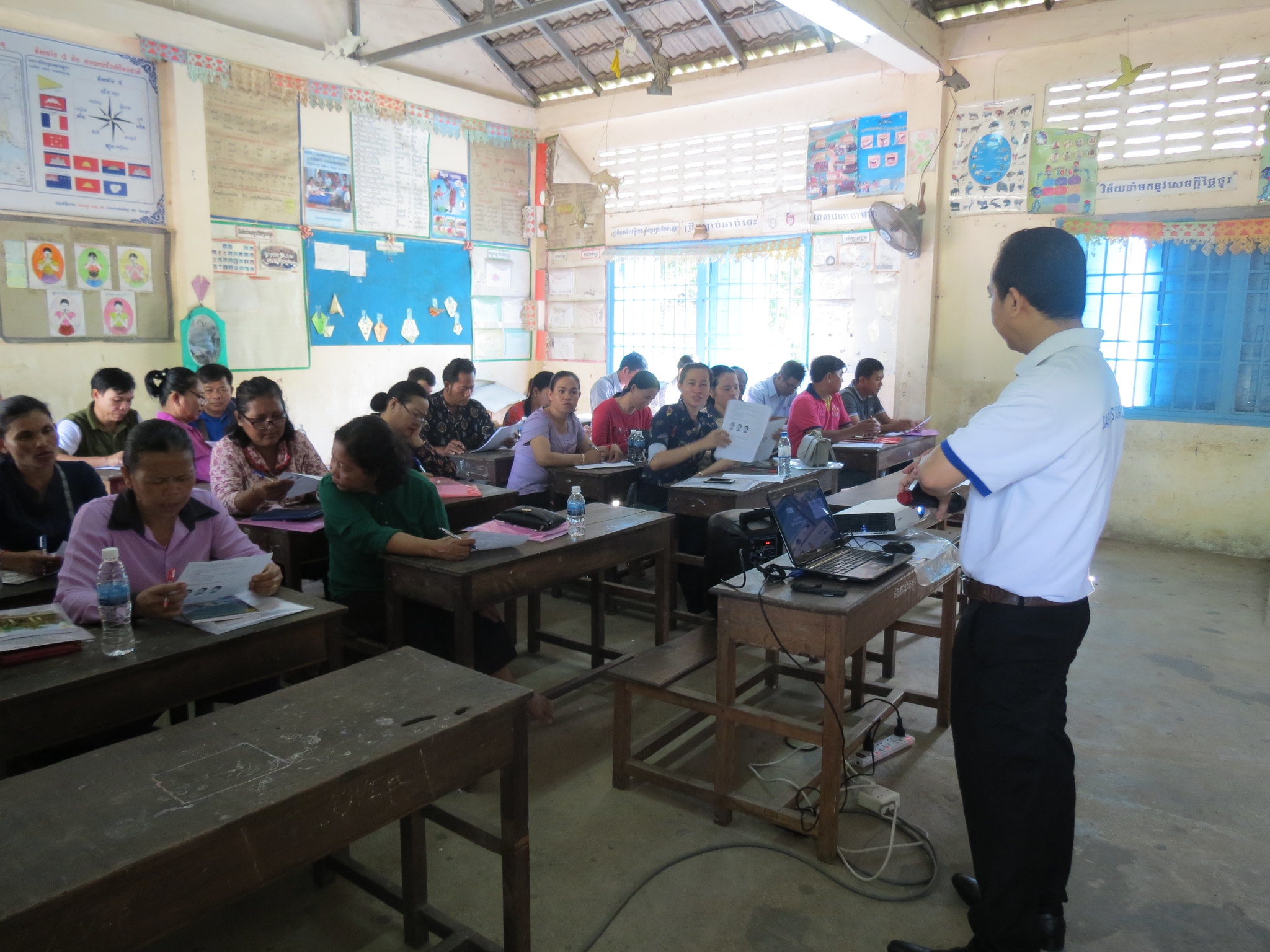 Teachers collaborate on teaching materials to promote helmet use at the school