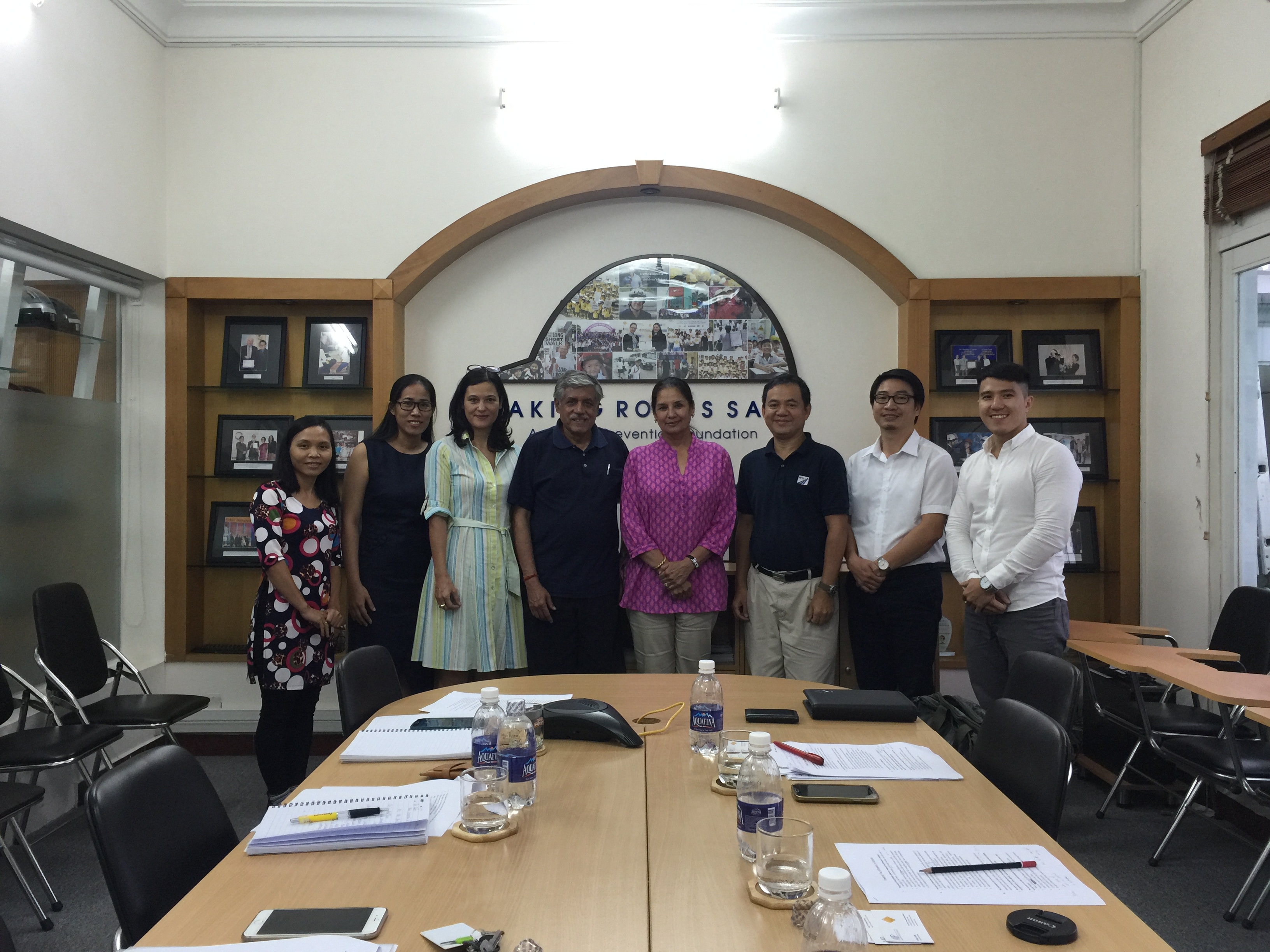 Dr. Rohit Baluja (center) and his wife, Sarita, are joined by AIP Foundation staff at the organization’s Ho Chi Minh City office.