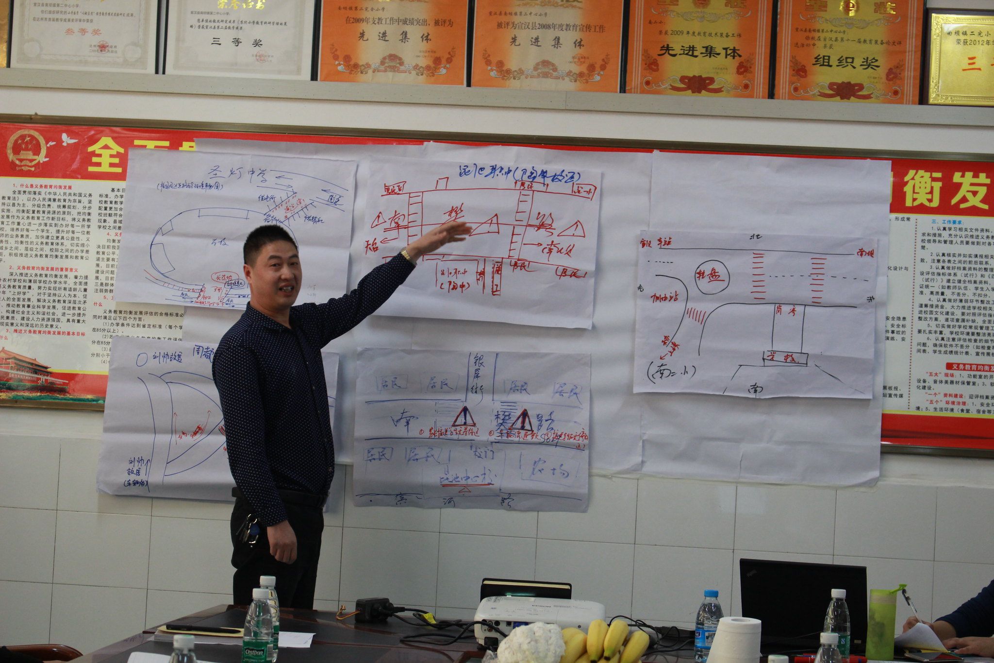 A participant in the stakeholder workshop presents plans for school zone environmental modifications.