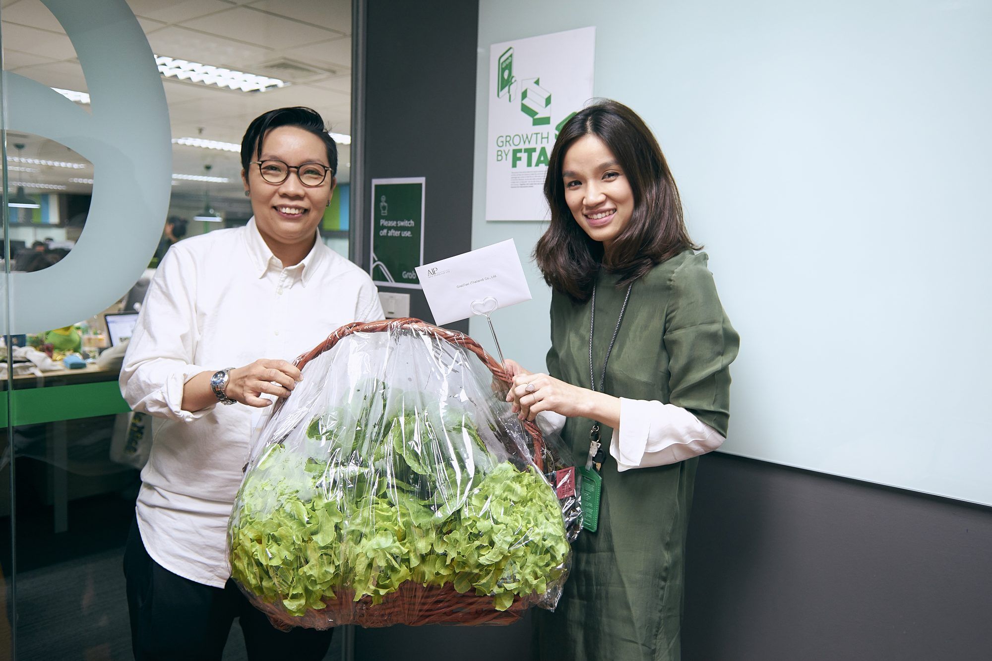 Thailand Country Manager Oratai Junsuwanaruk and team hand-deliver an organic gift basket to GrabTaxi’s office.