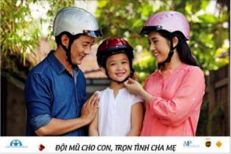 An example of one of the AIP Foundation billboards used in Vietnam – the caption reads “Love your child, provide a helmet”.