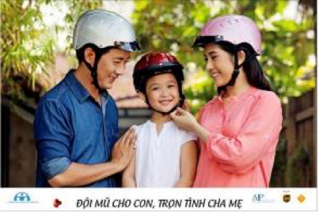 An example of one of the AIP Foundation billboards used in Vietnam – the caption reads “Love your child, provide a helmet”.