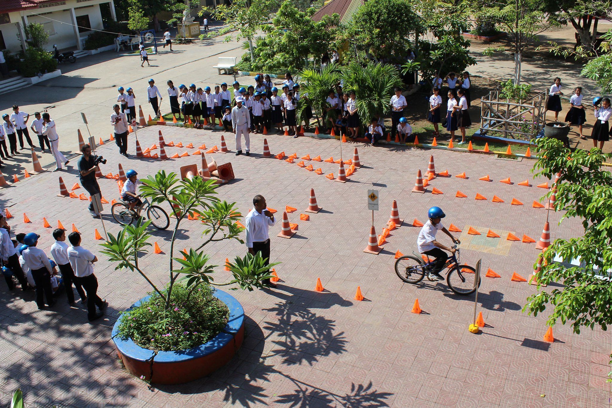 Students practice their bicycle driving skills on the road safety course.