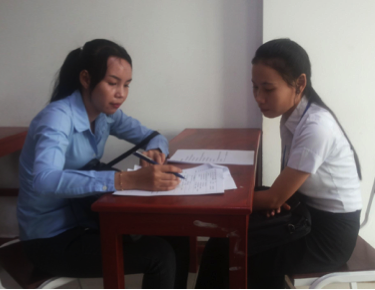 A university student in Cambodia participates in a survey.
