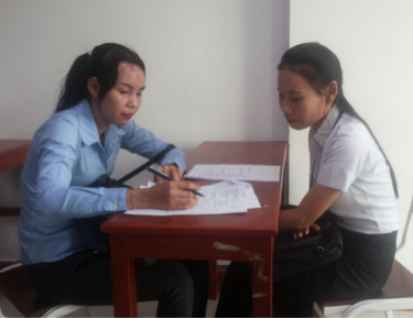 A university student in Cambodia participates in a survey.