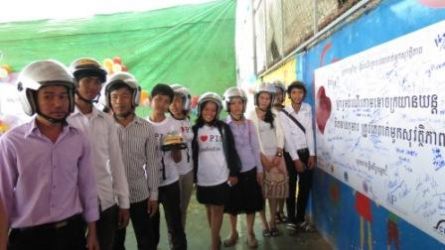 Maybank donates 100 helmets to children at the People Improvement Organization (PIO)