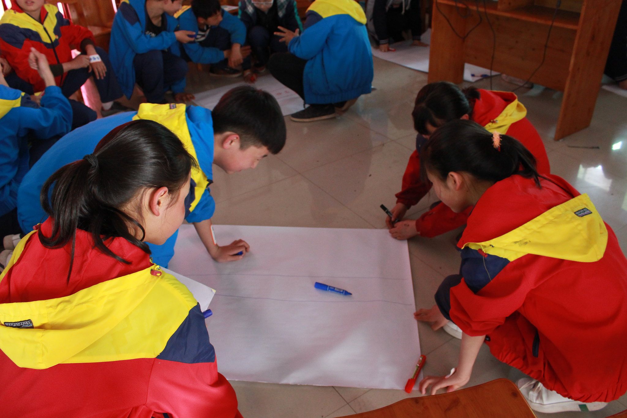 Students practice road safety concepts as part of the first photovoice workshop.