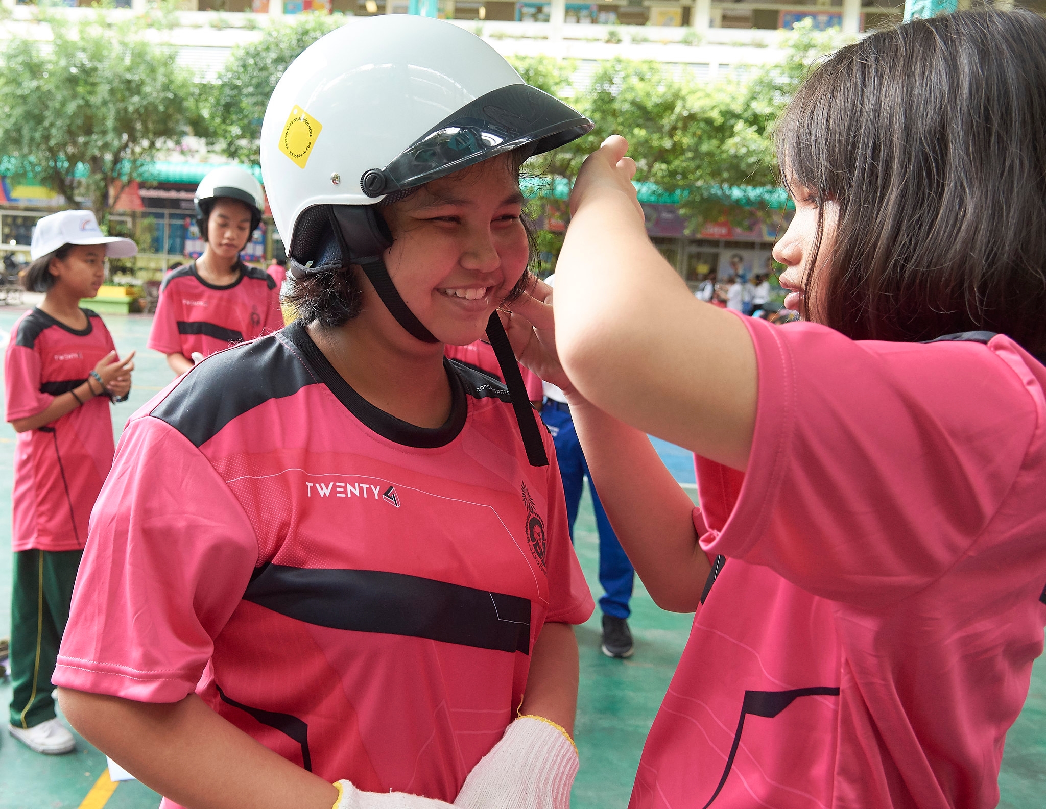Students demonstrating proper helmet use during the extra-curricular activities