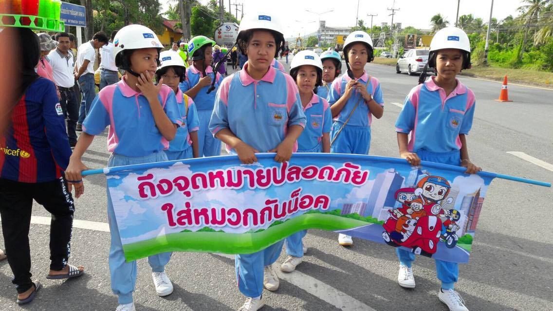 Students from Singhanakhon District walk in the parade on behalf of Street Wise to advocate for helmet safety.