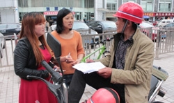 Volunteers gather feedback from motorcycle taxi drivers to inform future AIP Foundation programming.