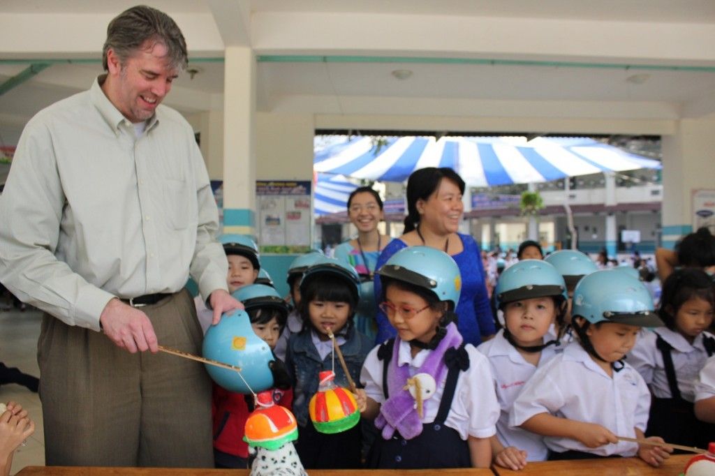Mr. Joseph McKillips, Sr. Manager, Commercial Program Support, Global Environment, Health, and Safety for Abbott plays road safety games with students. These activities reinforce previous interventions by AIP Foundation.