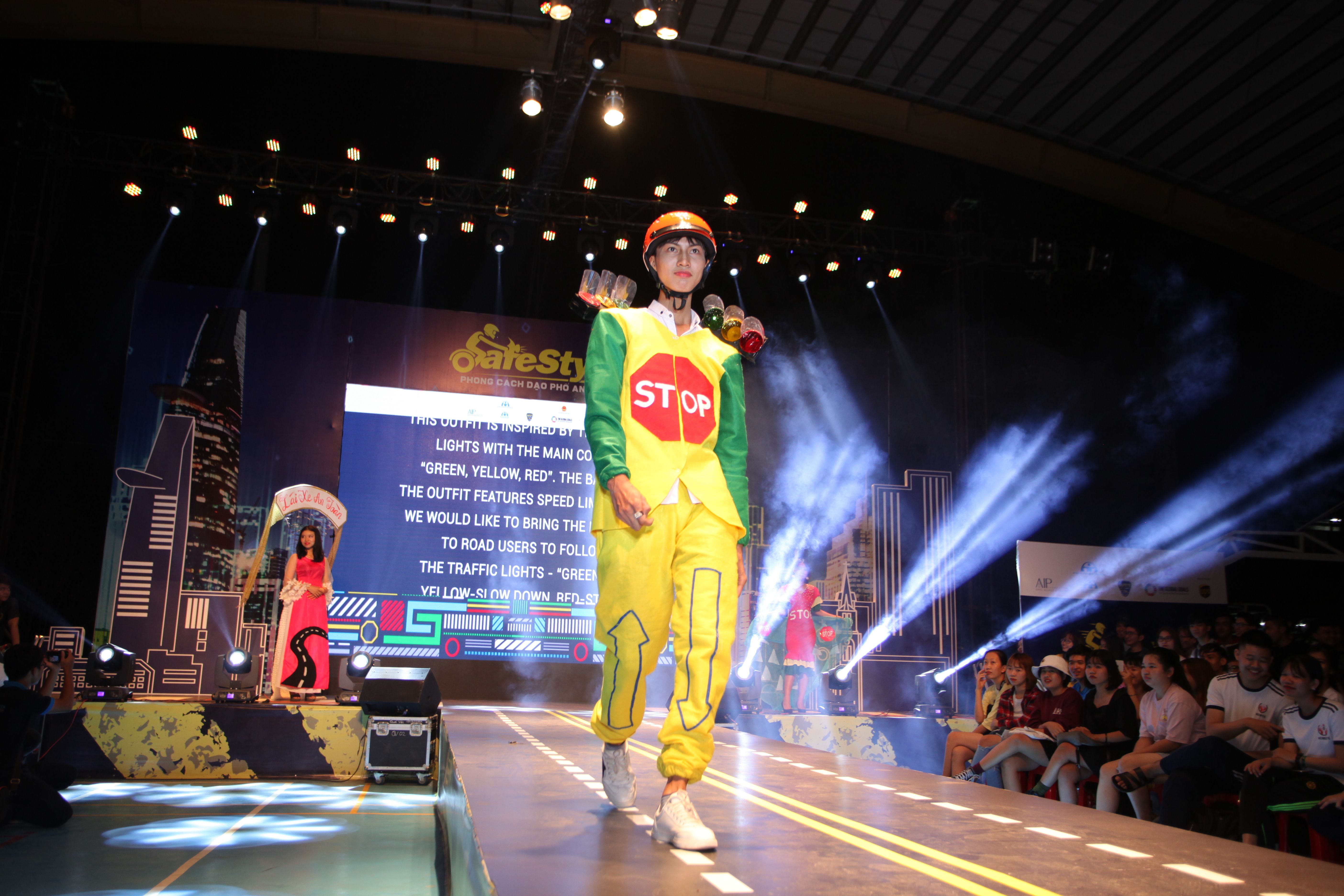 Local university students from Ho Chi Minh City walk the runway in their self-designed road safety themed outfits.