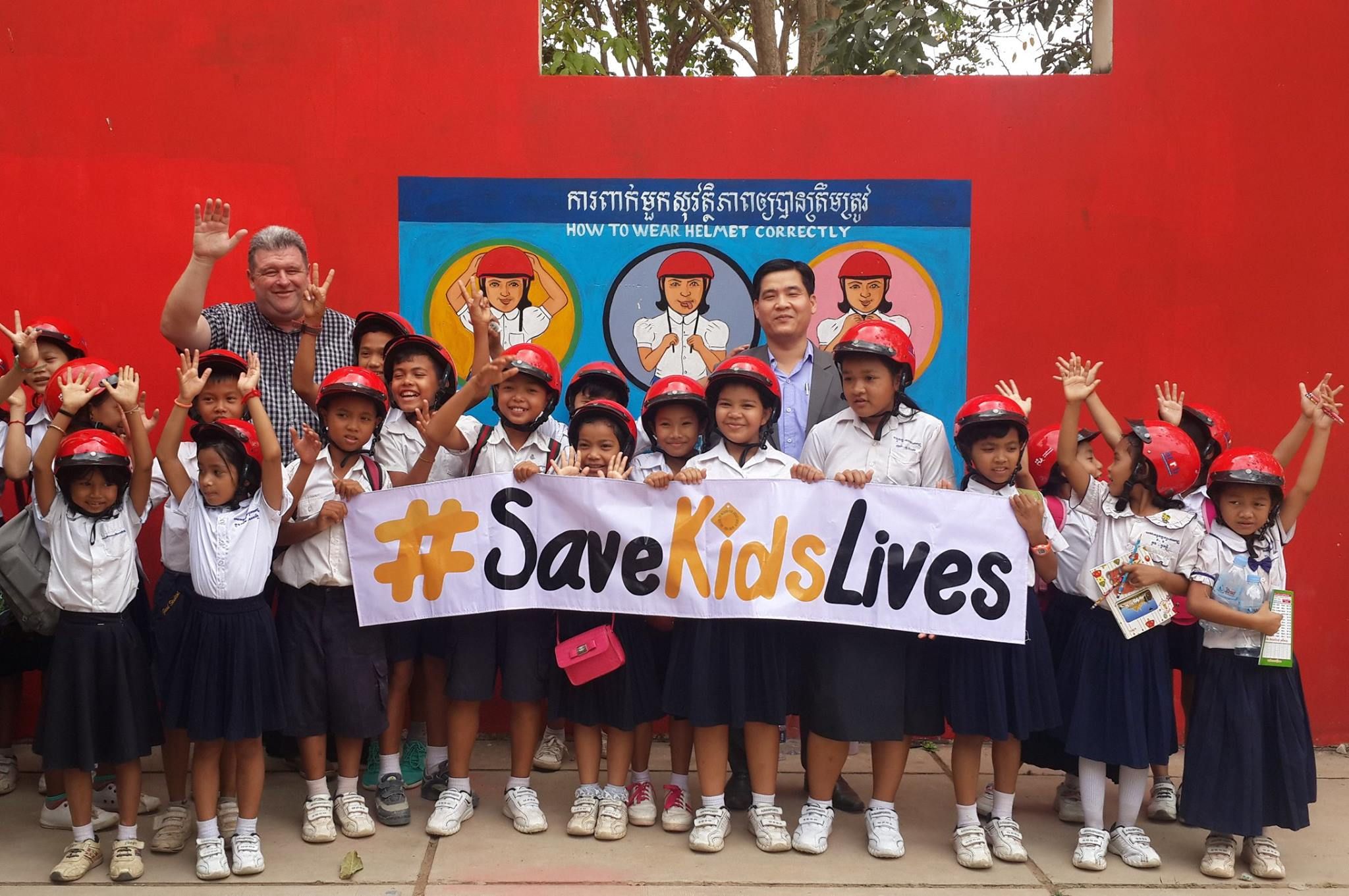 Students from Anuk Wat Koruk Kosal Primary School in Siem Reap Province show off their new helmets.