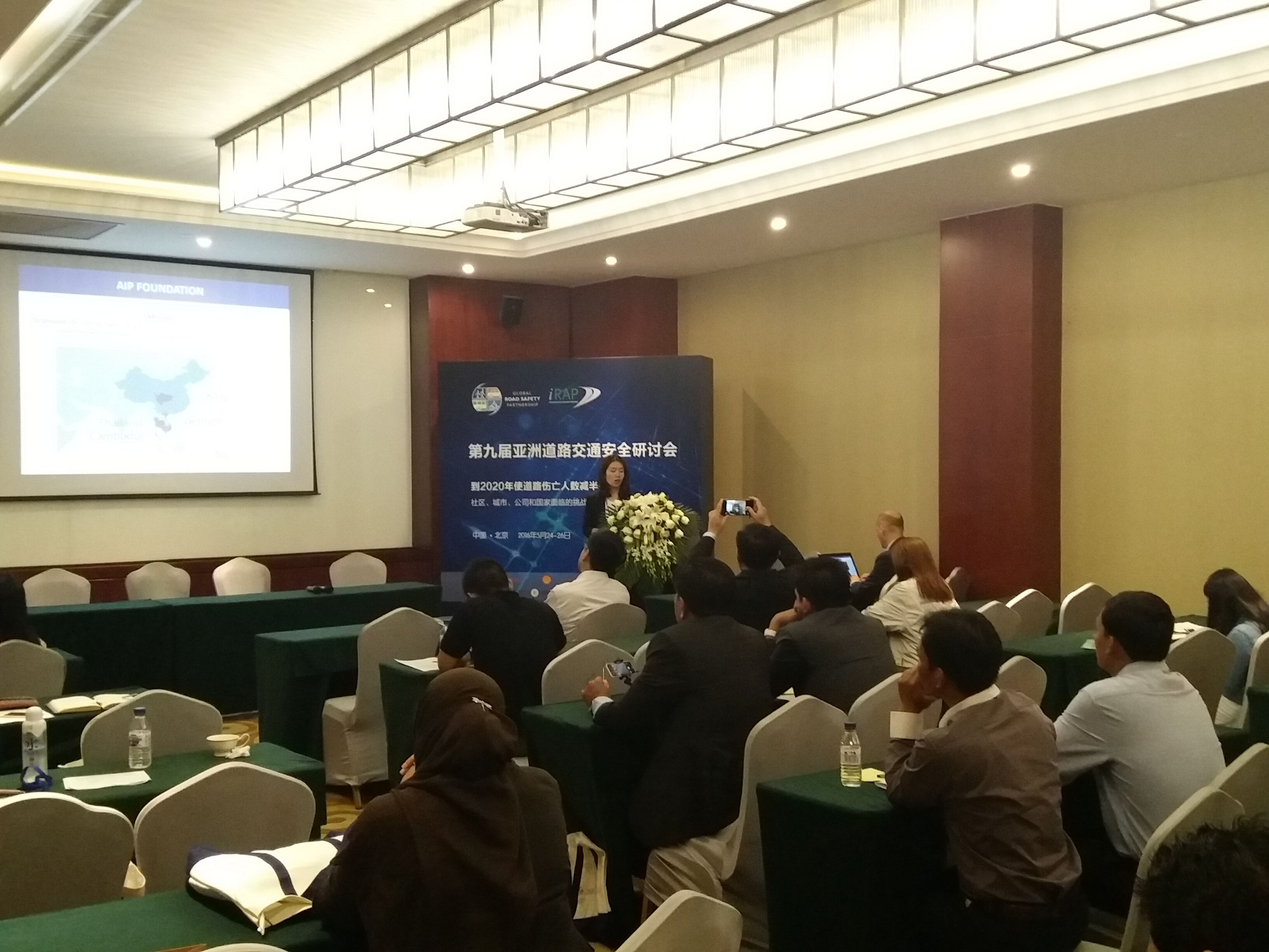 Ms. Xu from AIP Foundation China presents a report based on work done to enhance the safety of local communities in the Chongqing.
