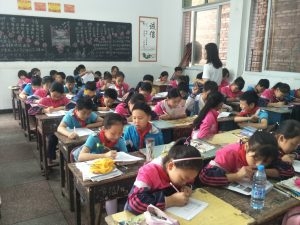 Students participate in knowledge test to evaluate road safety curriculum.