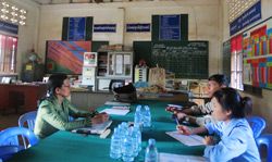 The review committee meets to discuss candidates for the “Schools of Excellence” competition.