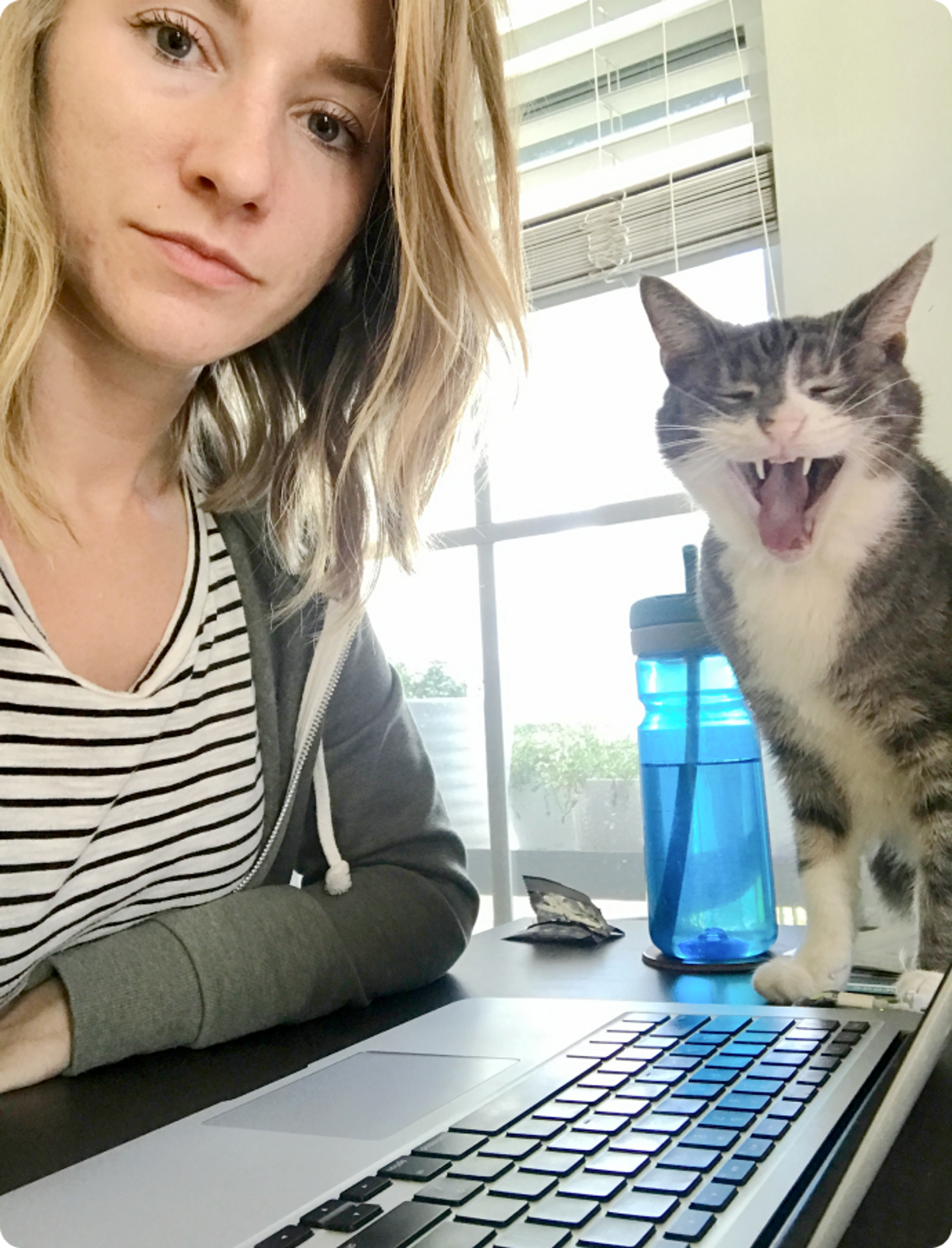 Ryann and her yawning cat, Kiki