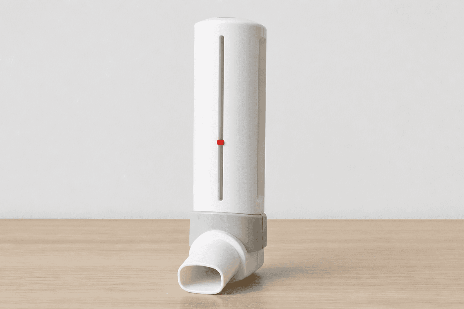 Peak flow meter standing on a clean table with unmarked shaft.